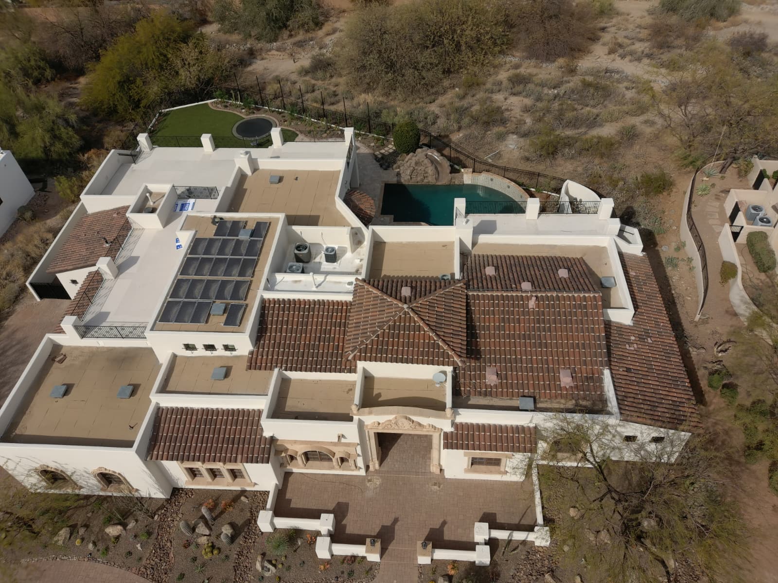 Aerial before view of Phoenix flat roof areas before foam roofing and coating work